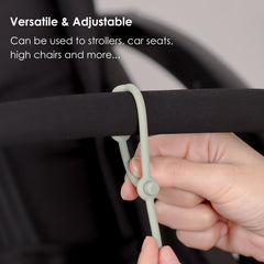 Andy Bear toy straps on a car seat for easy reach of sippy cups.