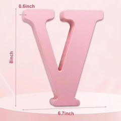 AOCEAN pink wood letter on desk ready to spell names.