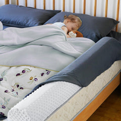 Aonvmdis semi-cylindrical foam bumper supports safe sleep without bulk.