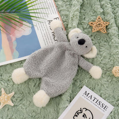 Apricot Lamb koala security blanket shown in nursery decor and cuddle