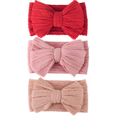 AQOKKA baby bows headband with a big bow, ideal for photo-ready outfits.