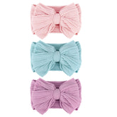 AQOKKA baby bows headband close-up showing vibrant bow for photo-ready styling.