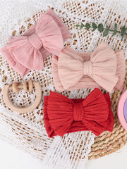 AQOKKA newborn photo prop bow headband adds charm to family pictures.