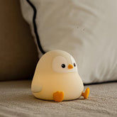 ATSUI Penguin Night Light front view with a soft, calming nursery glow.