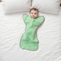Aullar baby transition swaddle showing three-stage transition system for easy changes.