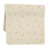 AVA + OLIVER vegan leather changing mat folded in a diaper bag for travel.