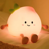 AVEKI Peach Night Light face: cute smile for calm bedtimes and safe night checks.