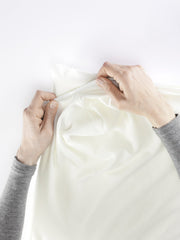 BabyBjörn fitted sheet being machine washed for easy care.