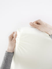 BabyBjörn organic cotton sheet close-up, hypoallergenic softness for baby skin.