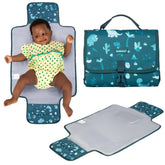 BabbleRoo changing pad with waterproof Dino pattern for travel-friendly use.