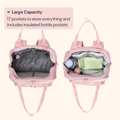 BabbleRoo pink Birdy stroller clips attached for hands-free travel convenience.