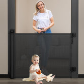 Babepai retractable baby gate on stairs demonstrates space-saving safety.