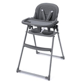 Babilous foldable high chair folded for compact storage in small kitchens.