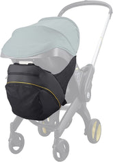 Baby & Beyond clip-on storage bag on Doona attachment keeps essentials within easy reach.