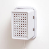 Baby Block oversized outlet cover blocks sideways plugs for safer toddler-proofing.