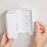 Baby Block sim-key lock outlet cover demonstrates adult-access protection for children