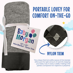 Baby Morgan thermal waffle blanket gray folded demonstrates compact portability for on-the-go families.