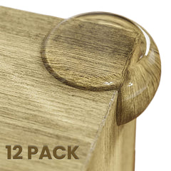 Baby Proof Me table corner protectors 12-pack on wooden edge for safe play.
