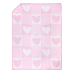 Baby Starters pink and white patchwork blanket folded for nursery warmth