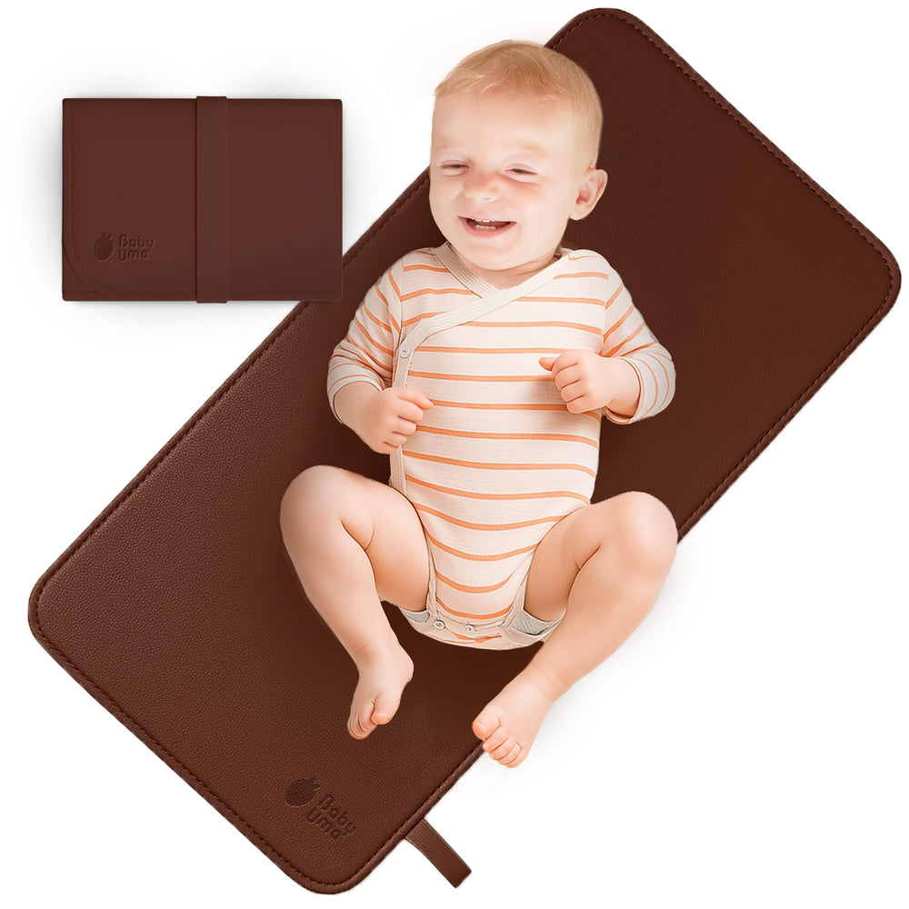 Baby Uma vegan leather changing mat with waterproof surface for clean diaper changes.