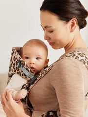 BabyBjörn Baby Carrier Mini front-closure in use with sleeping baby