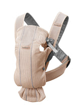BabyBjörn Baby Carrier Mini front view showcases newborn-ready design for quick sessions.