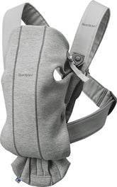 BabyBjörn Carrier Mini light gray front view for quick newborn closeness