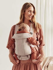 BabyBjörn Baby Carrier Mini material close-up 3D mesh highlights breathable, comfy wear.