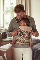 BabyBjörn Baby Carrier One in cotton beige/leopard, back view highlights sturdy waist belt.