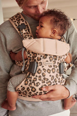 BabyBjörn Baby Carrier One, infant positioned, shows built-in newborn-friendly support.
