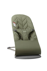 BabyBjörn Bouncer Bliss in dark green in use with ergonomic support.