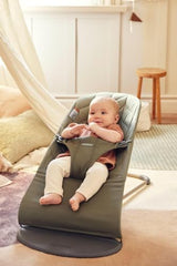 BabyBjörn Bouncer Bliss dark green woven fabric close-up showing texture and comfort.