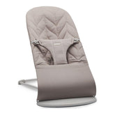 BabyBjörn Bouncer Bliss side view in sand gray fabric for close-by supervision