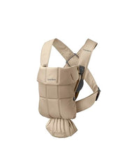 BabyBjörn Baby Carrier Mini beige woven newborn snug view demonstrates easy-to-use design.