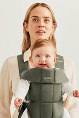 BabyBjörn Mini woven dark green close-up of soft fabric for gentle skin contact.