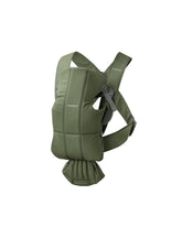 BabyBjörn Mini woven dark green worn by baby for cozy newborn snuggle.