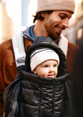 BabyBjörn Winter Cover shows ultralight padding for warmth on the go.