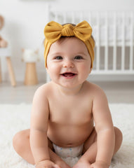 Babygiz handmade turkey headband mustard shows craftsmanship and skin-friendly stretch.