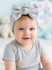 BABYGIZ headband stone gray on baby demonstrates secure fit for all-day comfort