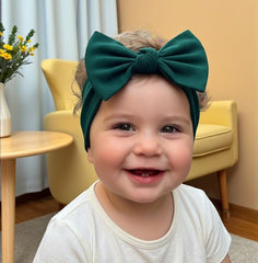 BABYGIZ newborn headband with bow closeup, highlighting gentle stretch for delicate hair.