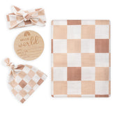 BabyWhale swaddle blanket checkered fabric close-up highlighting ultra-soft bamboo-cotton blend for delicate skin.
