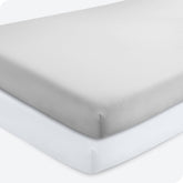 Bare Home 2-pack fitted crib sheets in cloud grey show elasticized stretch for snug crib fit.