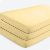 Bare Home 3-Pack Crib Sheet Morning Sun folded, ultra-soft microfiber for baby comfort.
