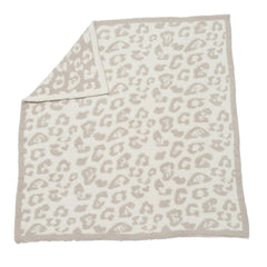 Barefoot Dreams CozyChic baby blanket with wild print; plush warmth for snuggly moments.