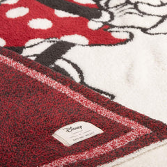 Barefoot Dreams CozyChic Disney blanket stroller-nap demonstrates easy layering during travel.