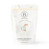 Bathorium Little Charlie Bath Soak bottle pour showing nourishing ingredients for delicate baby skin