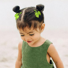 BBGifts grosgrain ribbon bows on wrapped snap clips show secure wear.
