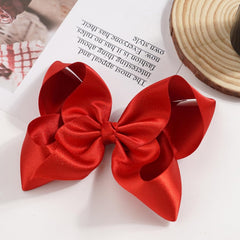 BBGifts large bow on ponytail demonstrates versatile accessory for braids