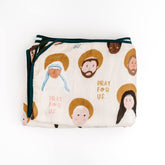 Be A Heart muslin blanket close-up with saint design for nursery peace