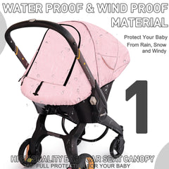 Beatoutou windproof car seat canopy in pink blocks wind while baby looks out.